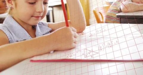 Girl writing math on graph paper in classroom, generating red grid and floating Stock Footage 312281034