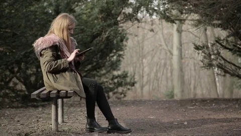 The girl is writing a message on the tablet Stock Footage 73259061