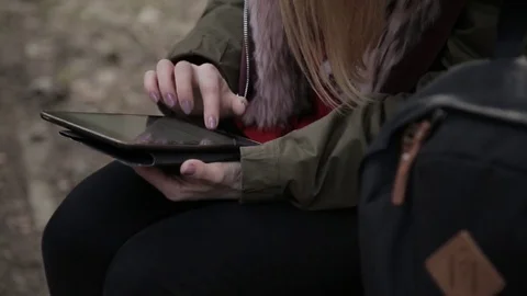 The girl is writing a message on the tablet Stock Footage 73259087