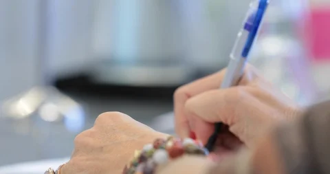 Girl Writing Notes In her Notebook At An Event Stock Footage 96086433