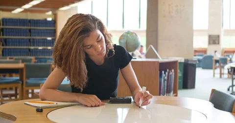 Girl writing out math problem on dry erase board 4k Stock Footage 49683607
