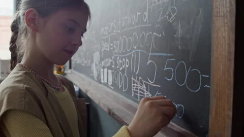 Girl Writing Robotics Programming Code on Blackboard in Stem Class Stock Footage 339189202