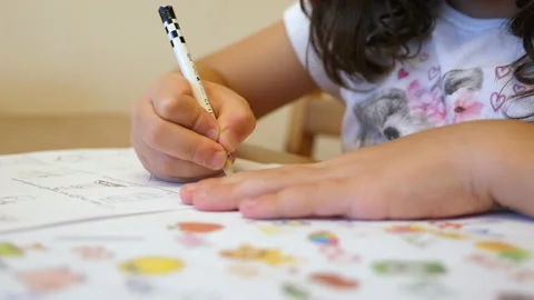 A girl writting with pencil Stock Footage