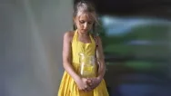 Girl In A Yellow Dress With A Jug Of Lemonade In The Hands. Hd Cinemagraph - Stock Footage