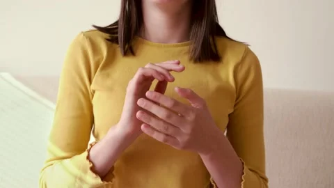 Girl in yellow top practicing EFT tapping Video stock 165238260