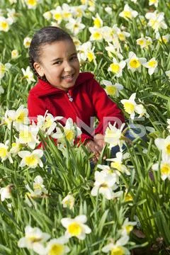 Girl young child playing spring time fun Stock Photos
