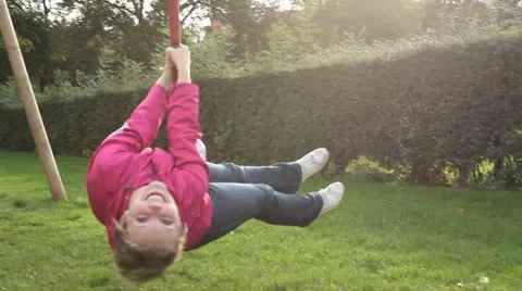 Girl on Zip Line Looking at Camera Stock Footage 10684485