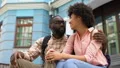 Girlfriend and boyfriend having fun together, sitting stairs, urban date outdoor HD Footage