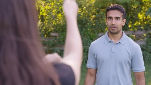 Girlfriend does funny lasso dance move on boyfriend.  - Slow Motion - shot on Stock Footage 125166116