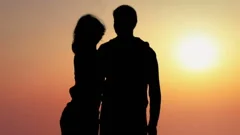 boyfriend and girlfriend kissing sunset