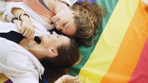 Girlfriend lying on rainbow flag Video stock 111267317