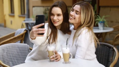 Girlfriends have fun in cafe Stock Footage 122044906