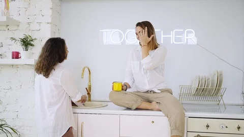 Girlfriends have fun on kitchen Stock Footage 110899007