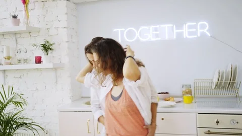 Girlfriends have fun on kitchen Video stock 111267281