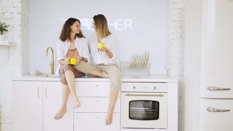 Girlfriends have fun on kitchen Stock-Footage 111267917
