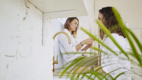 Girlfriends on kitchen Video stock 111267863