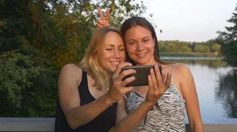 Girlfriends taking selfie in the park Stock Footage 66487190