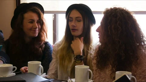 Girlfriends talking over coffee Stock Footage 60543494