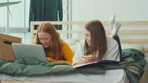 Girlfriends. Two Sisters Having Fun, Chatting, or Learning Online. Mental Health Stock Footage 163713884
