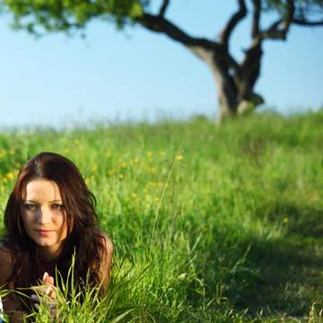 Girlfriends under tree Stock Photos