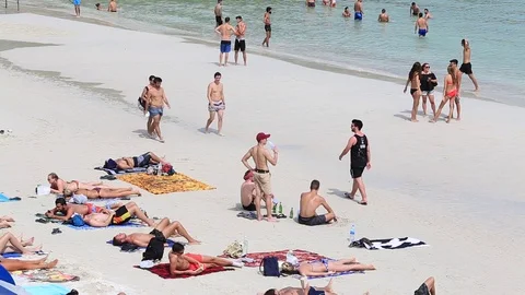Girls and boys on the beach before the full moon party, Koh Phangan, Thailand Stock Footage