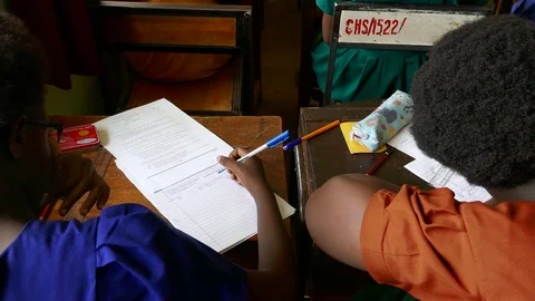Girls are doing homework / taking exam in a private school in Africa, Uganda Stock Footage 85131785