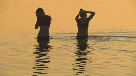 Girls bathing on sunset Stock Footage 35158292