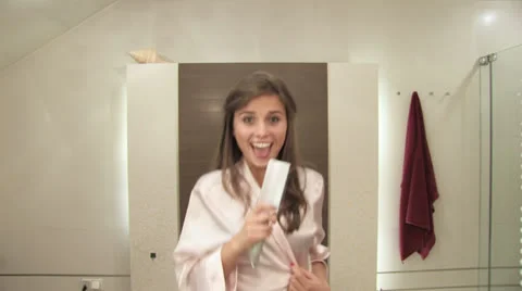 Girls bathroom routine Stock Footage 24674696