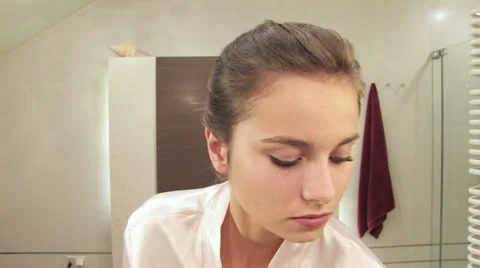 Girls bathroom routine Stock Footage 24710193