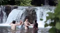girls of boys have fun in a lake - dancing, hugging and playing with water HD Footage