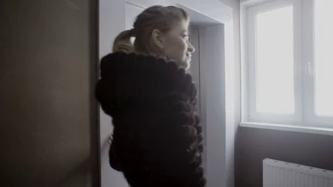 Girls call the elevator and wait Stock Footage 81828541