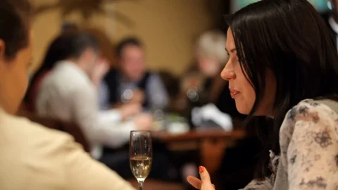 Girls chatting in cafe Stock Footage 100240804