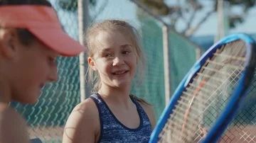 Girls chatting getting ready for their tennis lesson Video stock 85649752