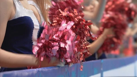 Girls cheerleaders at sporting event Stock Footage