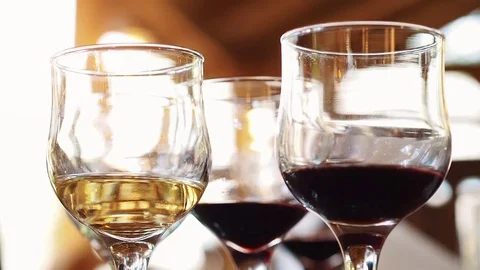 Girls clink glasses at the table Stock Footage 80426190