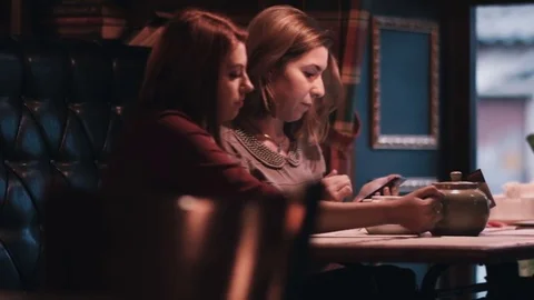 Girls communicate in cafe close-up Stock Footage 76577993