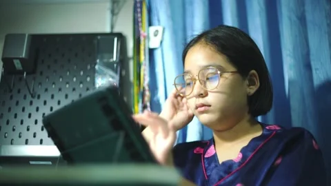 Girls concentrate on online learning with tablets in the bedroom Video stock 227290919