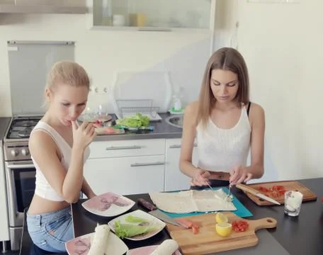 Girls is cooking Stock Photos