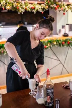 Girls at a culinary workshop on making a refreshing milkshake in a restaurant. Stock Photos