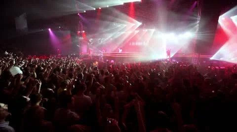 Girls dance on stage at popular dutch DJ Armin Van Buuren show Stock Footage