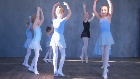 A girls dancer in a ballet school is learning to dance. Little ballerinas in Stock Footage 241121350