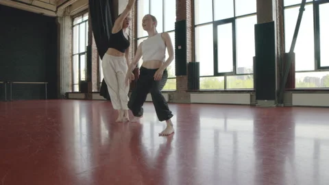 Girls Dancing Contemporary with Acrobatic Elements in Studio Stock Footage 257647539