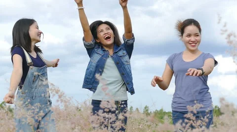 Girls dancing in field Stock Footage 65771316