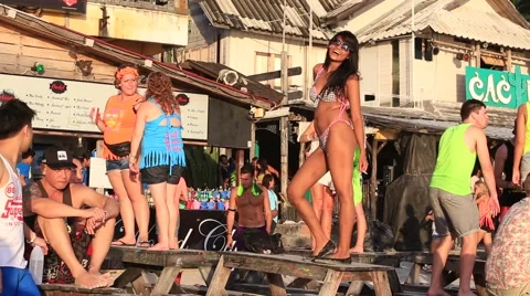Girls dancing on the tables on the beach. Island Koh Phangan, Thailand Stock Footage 44753053