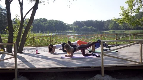 Girls doing exercise in nature Stock Footage 91853389