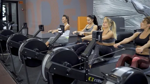 Girls doing exercise on simulators Stock Footage 91854541
