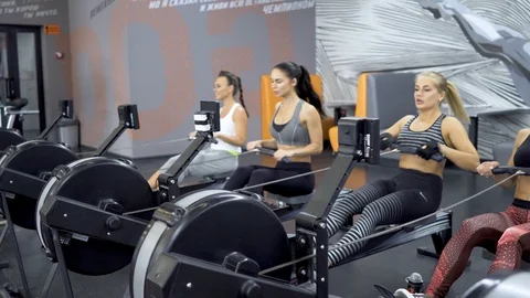 Girls doing exercise on simulators Stock Footage 91854991