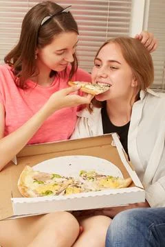 Girls eats pizza Photos