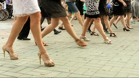 Girls in elegant dresses dancing dance Charleston in the Park. feet close-up Stock Footage 106713614