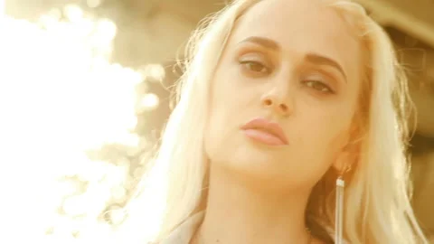 Girl's face in the rays of the setting sun Stock Footage 86127889